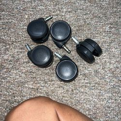 Set of five black office chair casters. Perfect for replacing worn-out wheels.