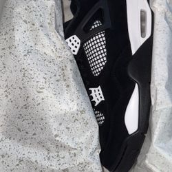 Black & White Thunder Jordan 4 
