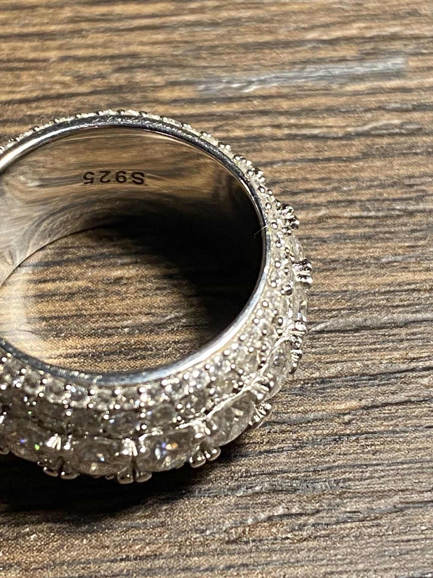 Real silver ring Coated with 22k White gold with diamonds will pass any Diamond testDiamond test bring one with you please