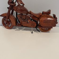 This Harley Davidson Heritage High Back motorcycle is handcrafted from solid mahogany