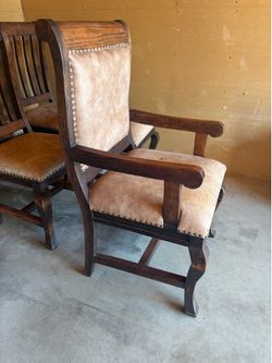 Spanish sold wood and leather chairs