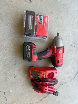 Milwaukee impact 1/2”  with charger and extra battery