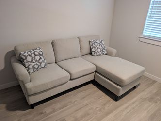 Beige sectional sofa with reversible chase