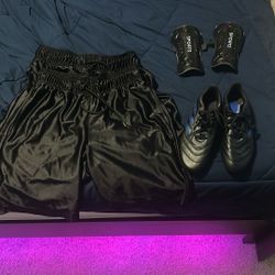 Youth soccer cleats, shin guards, and shorts
