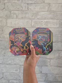 Pokemon mega charizard x and y tins