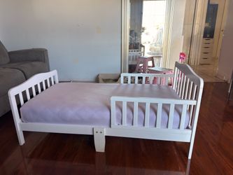 Toddler bed with mattress.