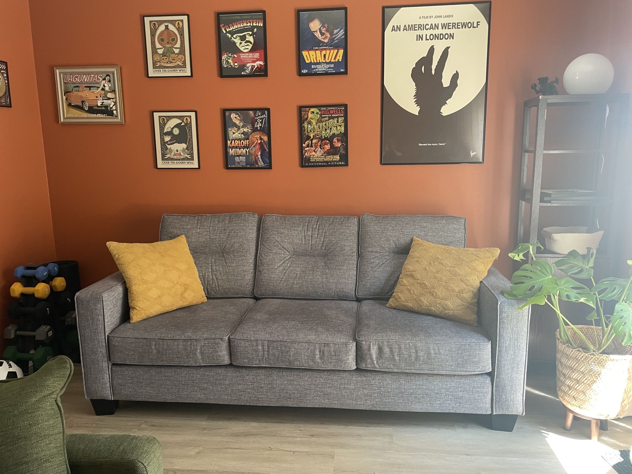 Gray Couch With Several Pillow Covers