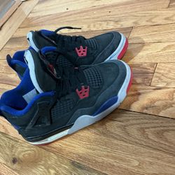 Black, red, blue Jordan 4’s