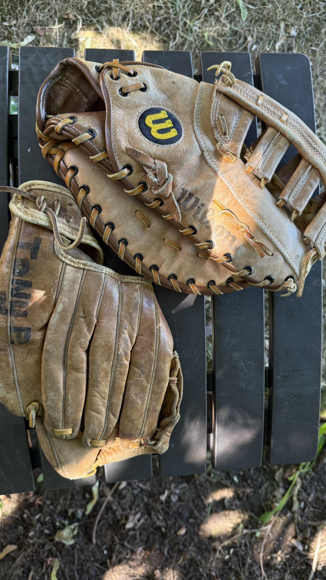 2 Vintage Baseball Gloves – Wilson & Tony P Selling two vintage leather baseball gloves. Both are well-used and show signs of wear: • Wilson glove –