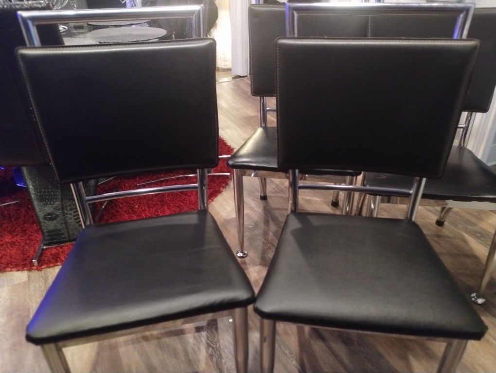 4 Black And Chrome Chairs 