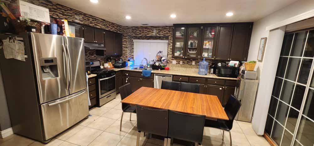 Extendable Wooden Table With 6 Black Chairs