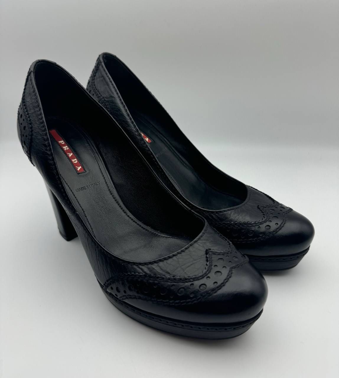 PRADA BLACK PATENT LEATHER BROGUE DESIGN HEELS SIZE 38.5