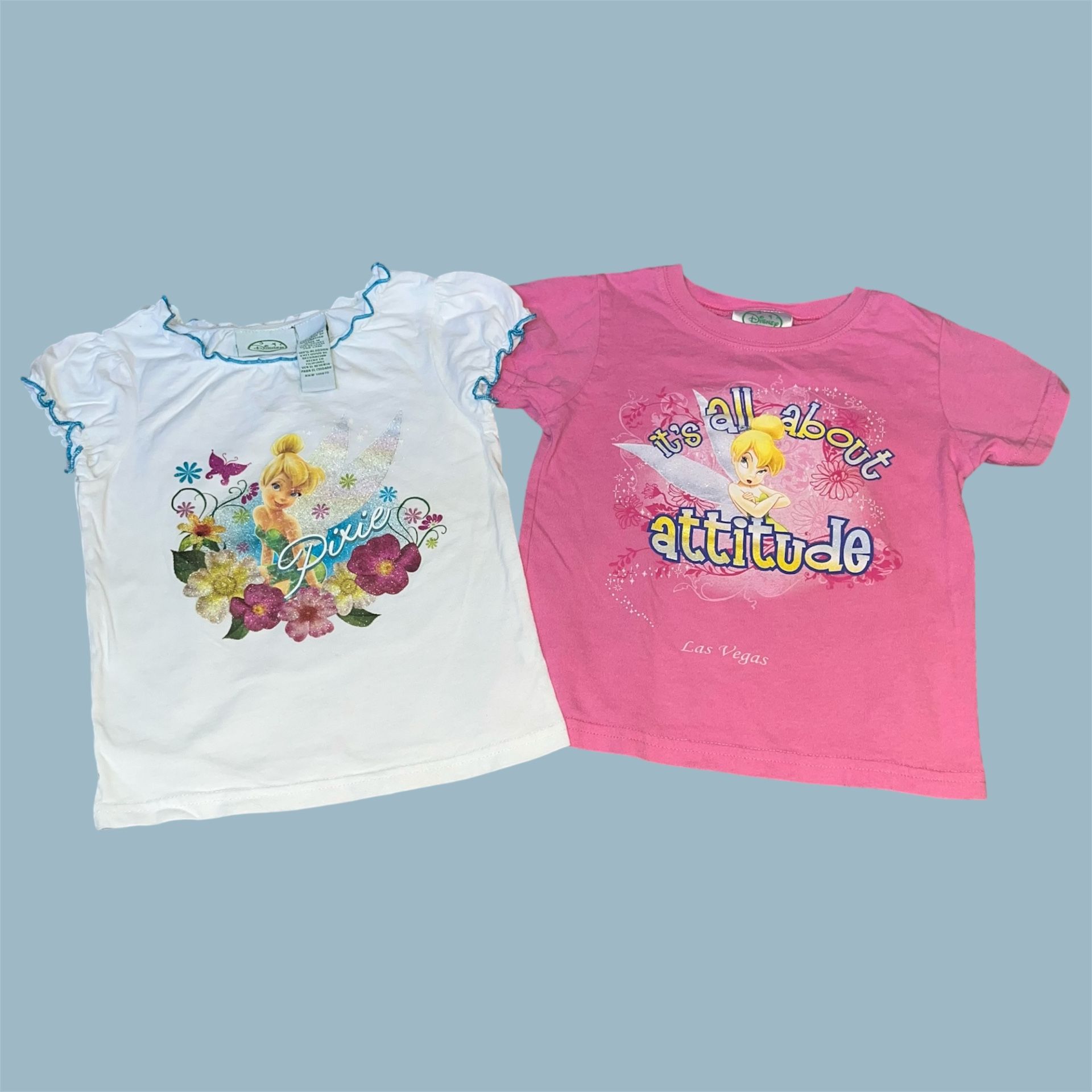 Two Disney Fairies tinker bell shirts size 4t - white floral “pixie” tinkerbell shirt, 100% cotton, 11/2009 - pink “It’s all about attitude” Las Vegas