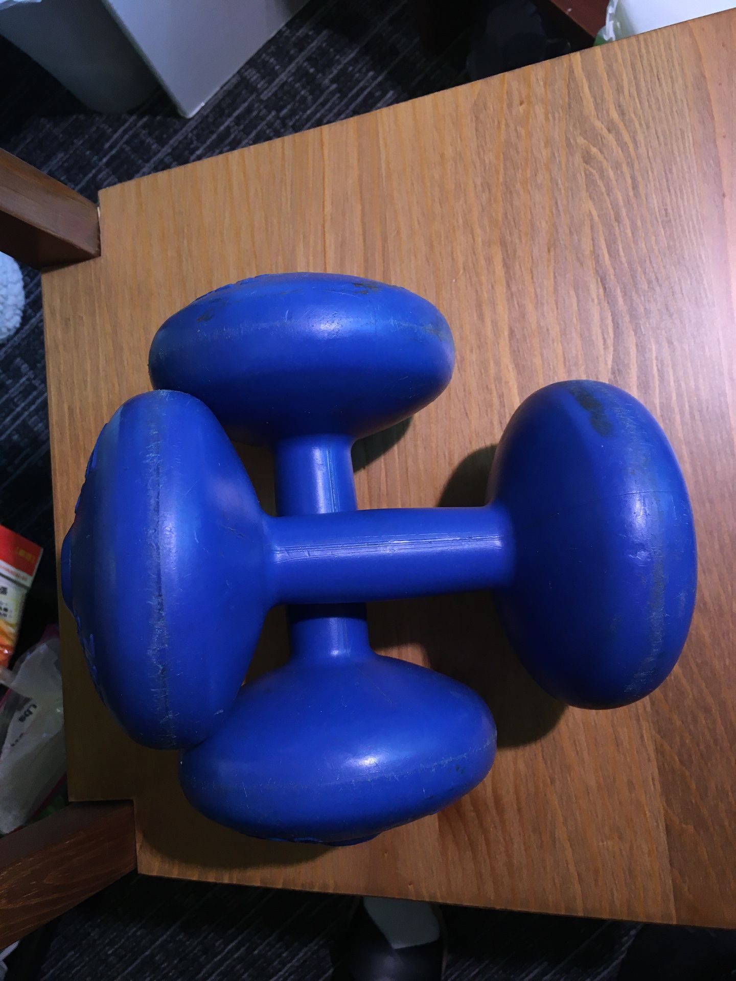 A pair of 5 lb dumbbells