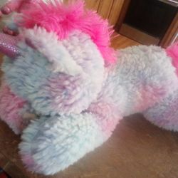 Plush Unicorns (one Is a toy unicorn).