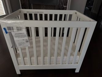 Rarely used mini baby crib with mattress