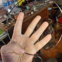 vintage silver-tone choker necklace with a circular pendant. 