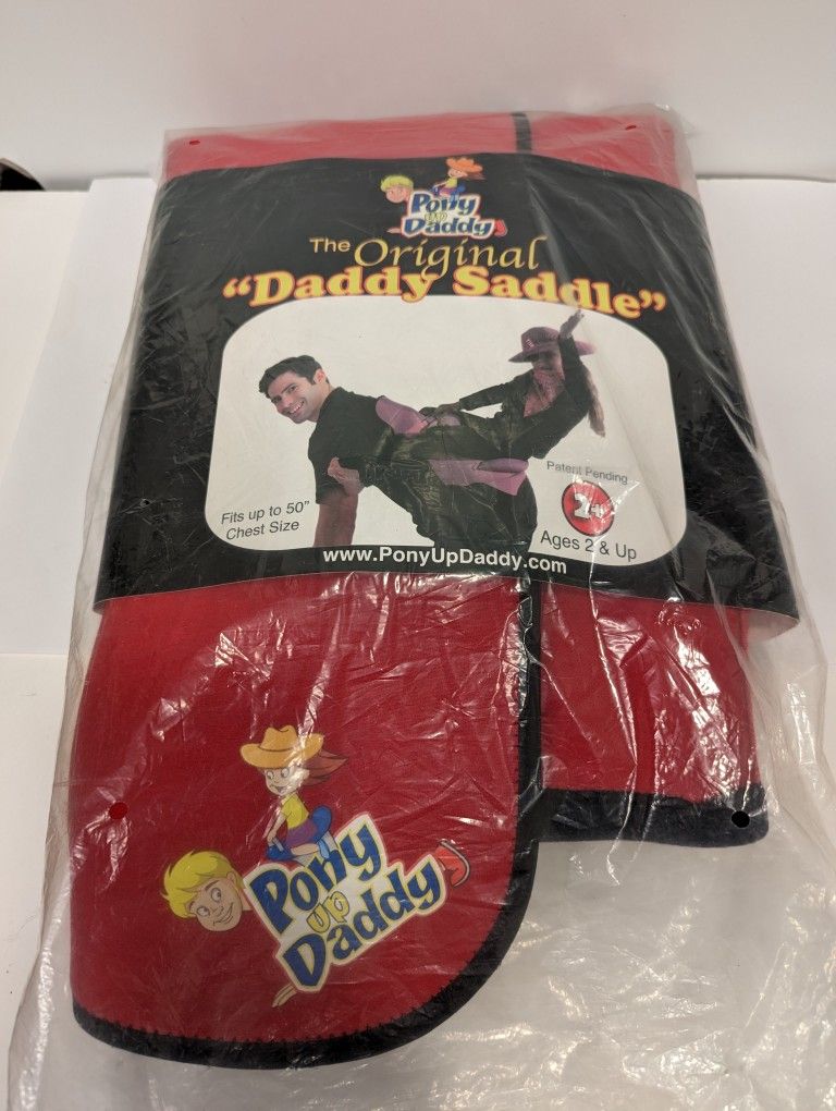 Pony Up Daddy Saddle For Little Kids To Ride On Big People. New In Package Condition. $10 Cash only.