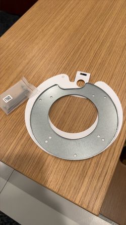 UniFi AP ceiling mount back plate and screws.