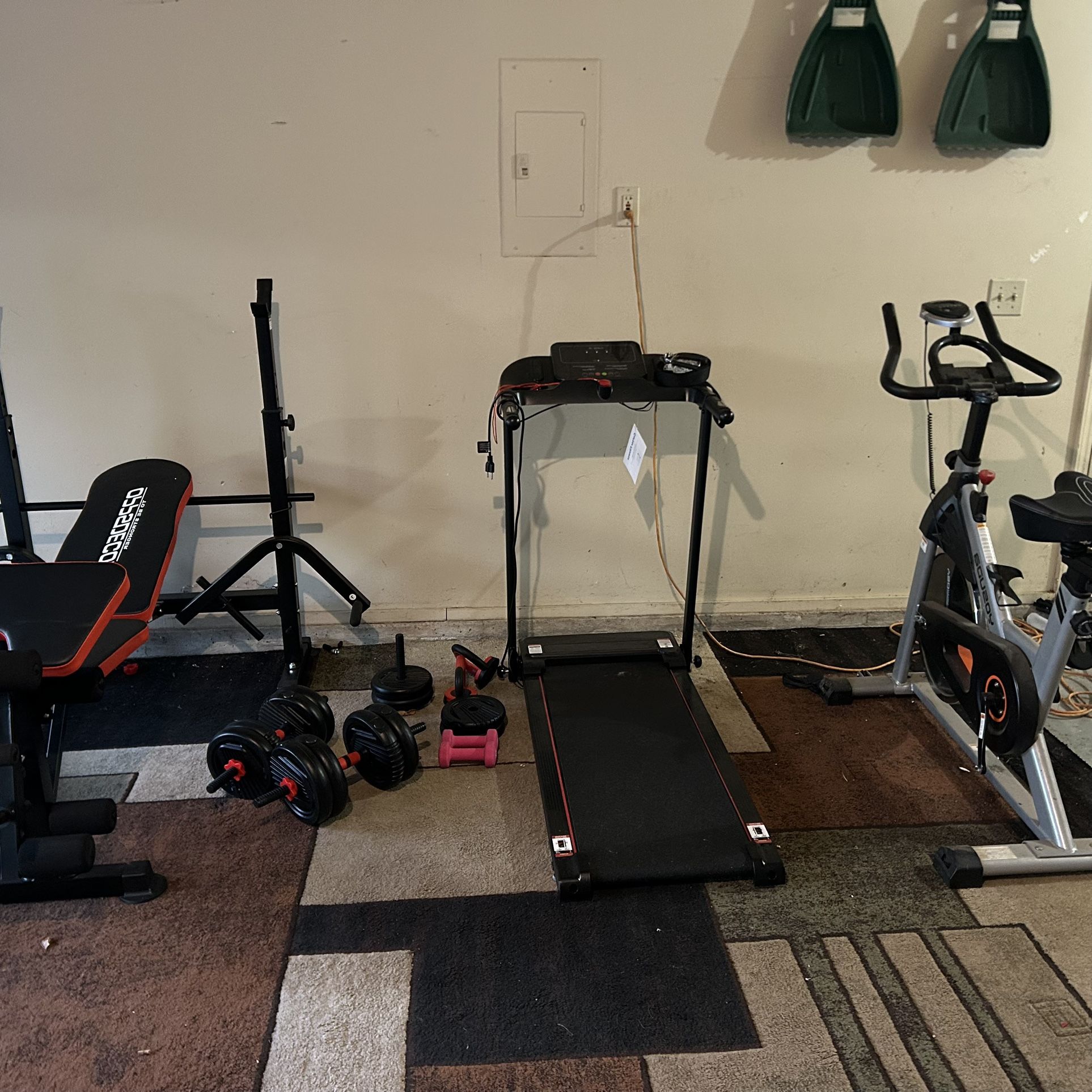 Bike, Treadmill And Weights With A Bench