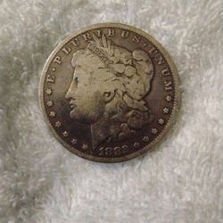 1882 and a 1921 Morgan Silver Dollar 