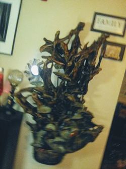 Handcrafted wall mounted self-contained wall fountain