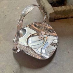 antique silver basket with a hinged handle.