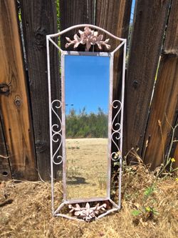 Ornate framed beveled metal mirror