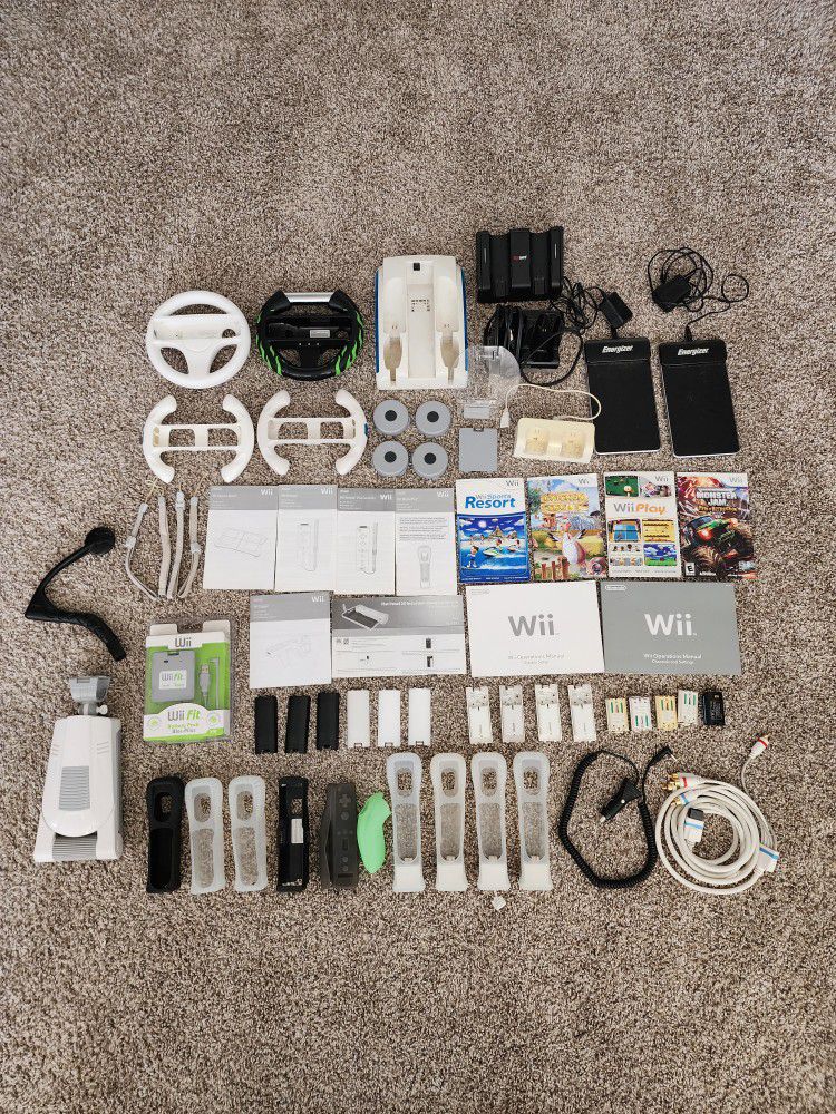 Nintendo Wii Accessories And Manuals (Battery Packs, Motion Plus Grips, Wheels, Charger Docs And More)