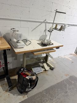Sewing machine table with portable sewing machine and supplies