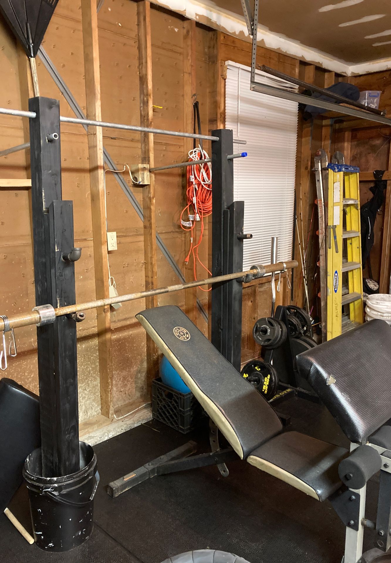 Home gym setup...bench, bar, weight tree and home made bench and squat rack