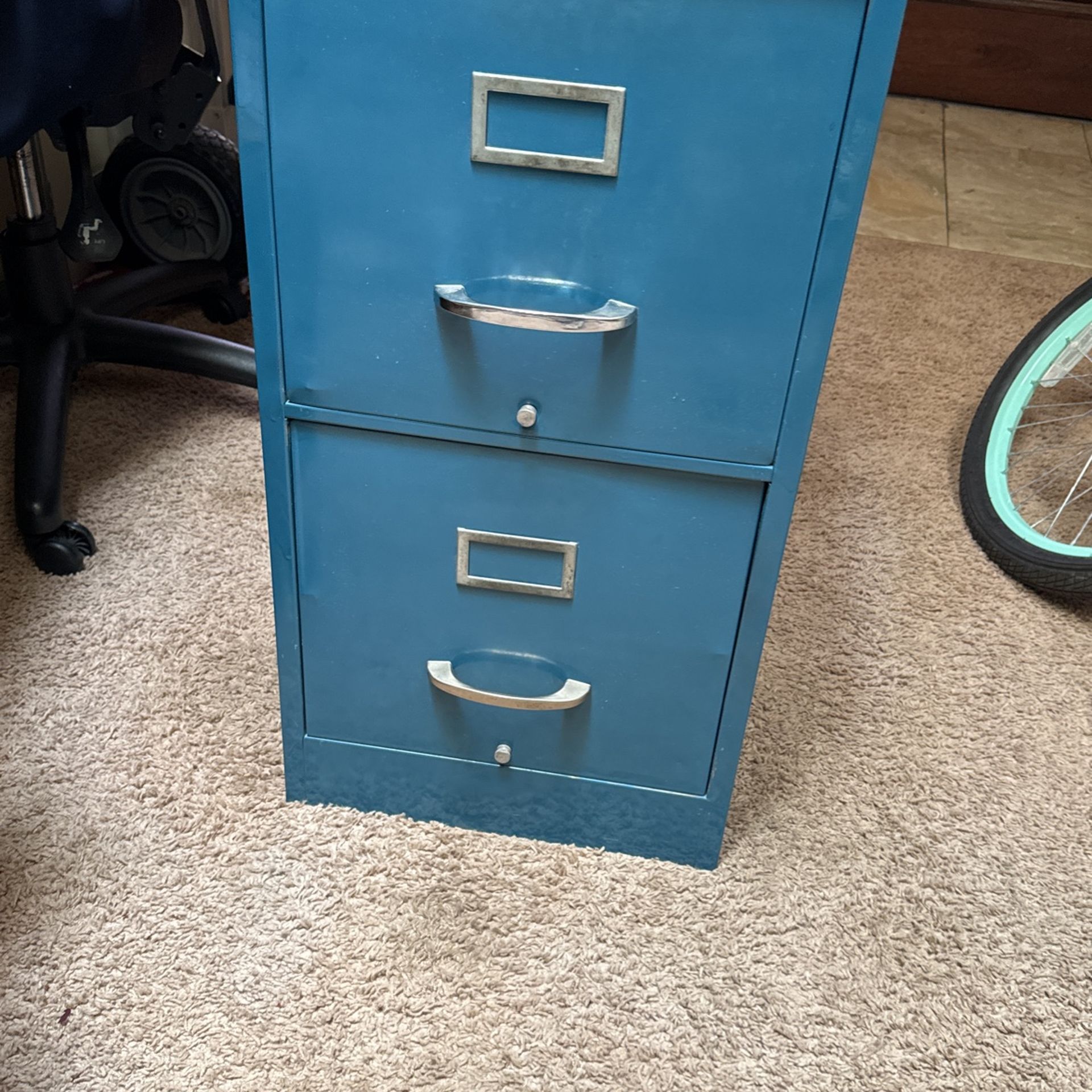 Blue two drawer metal filing cabinet