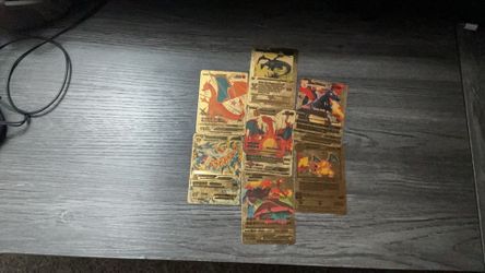 Seven Pokémon cards, 100% real two old ones so I am thinking of 35