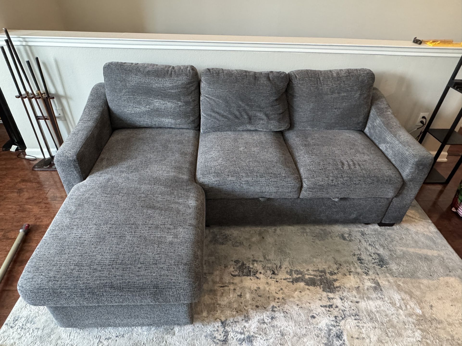 grey sectional with chaise, pullout ottoman, and electronic ports!