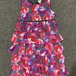This dress is a The Children's Place Floral Chiffon Sleeveless Ruffle Dress.  eBay eBay  +1 Product Details Design: A sleeveless, multi-tiered ruffle 