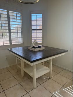 Dinner table with 4 chairs and a bench