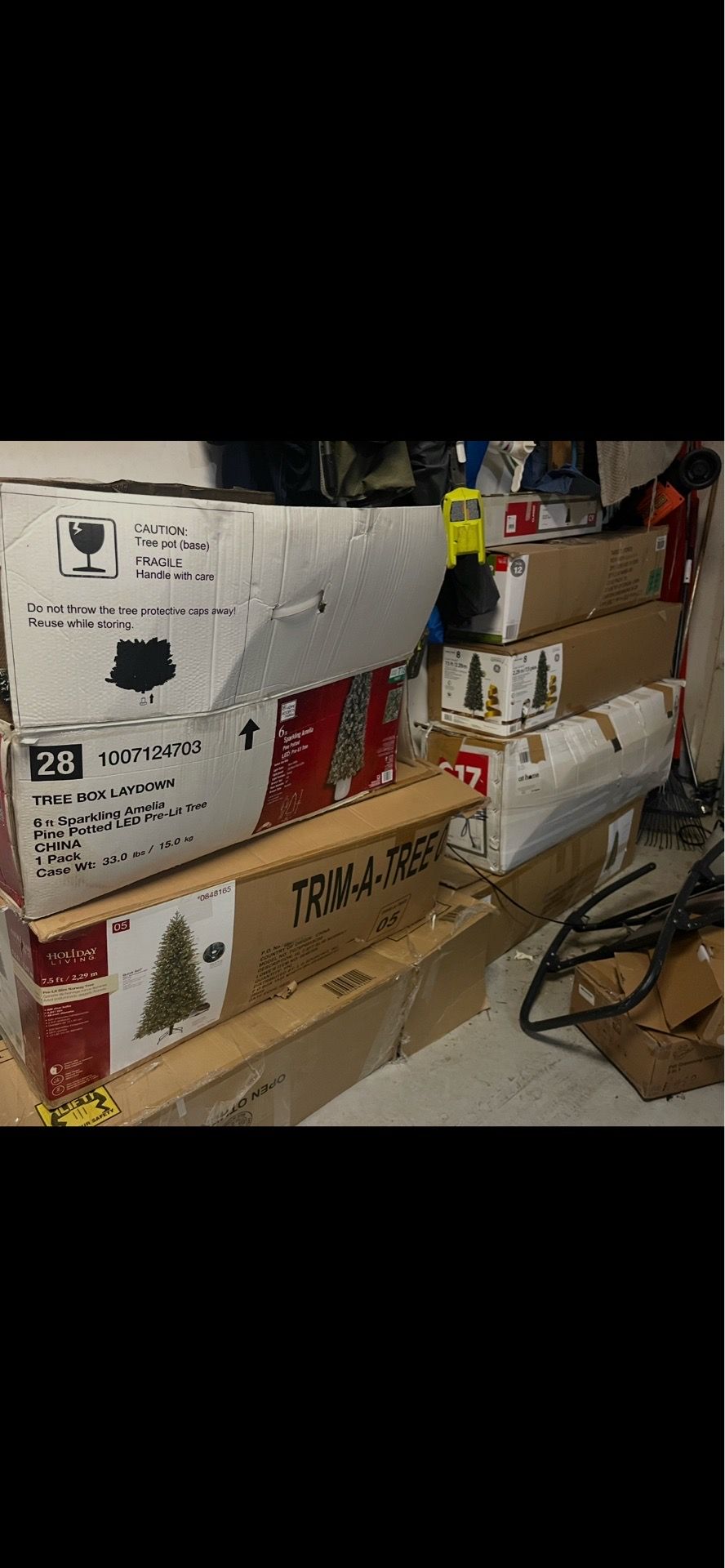 11 to 12 artificial Christmas tree trees in boxes with decorations
