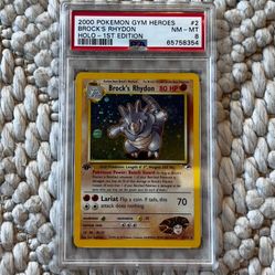 Brock's Rhydon *Holo Swirl* 1st Edition PSA8 Pokémon Card - Gym Heroes #2/132