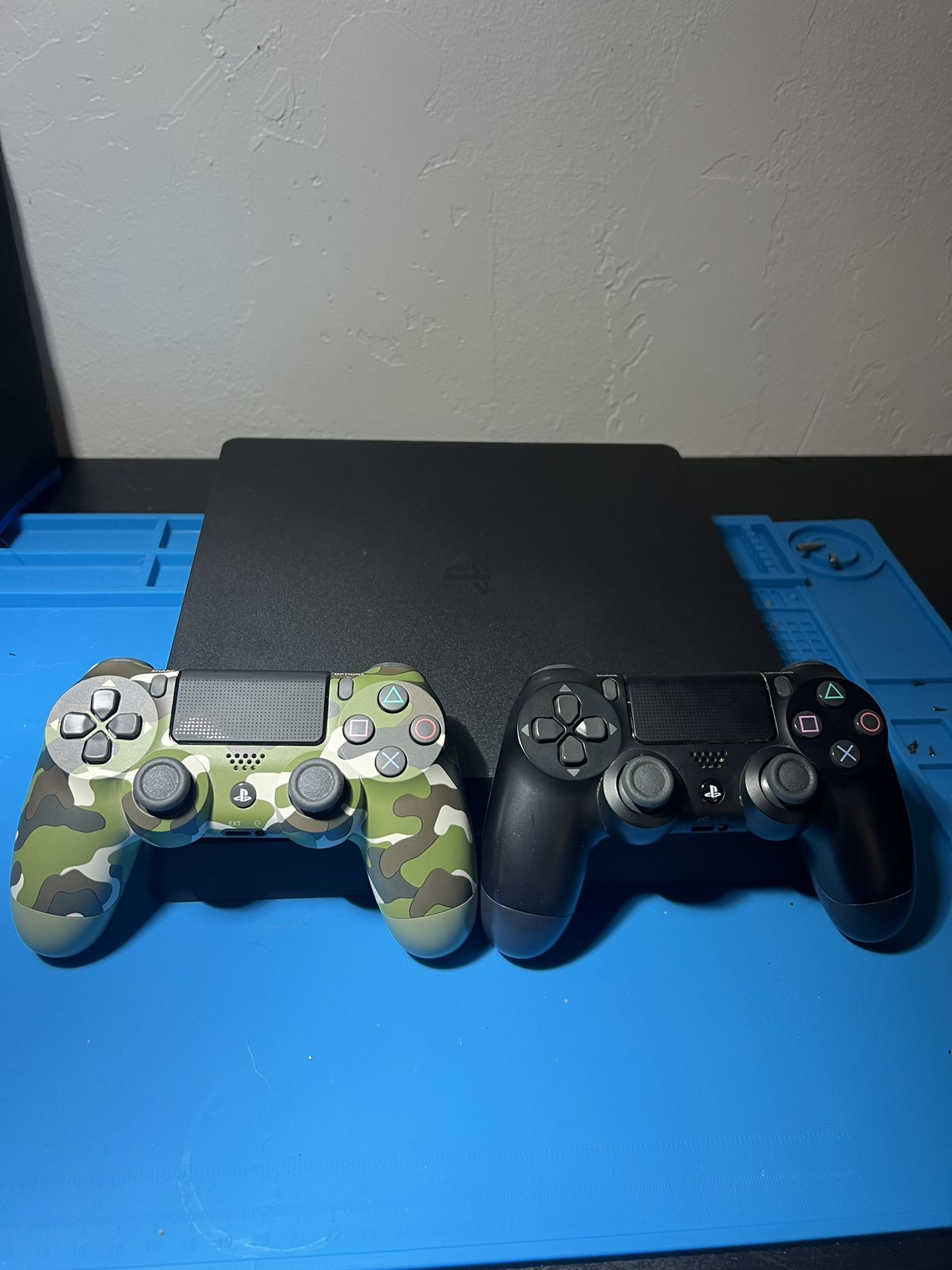 PlayStation 4 Slim W/ 2 Controllers