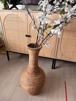 Wicker vase with faux flowers