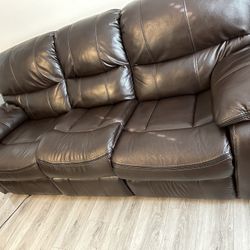Large 2 piece Brown Leather Couches with Reclining feature 