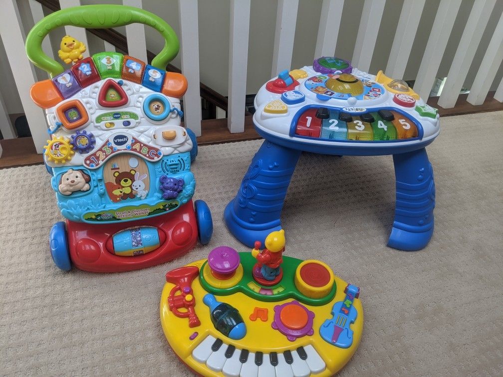 Walker, music board along with a instrument table that counts and sings. The legs are removable/floor play. All work and have language options.