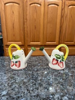 Vintage Ceramic Watering Cans Pair of Salt and Pepper Shakers with Fruit design.  Preowned with original cork stoppers.  Size approximately 3 1/4 inch