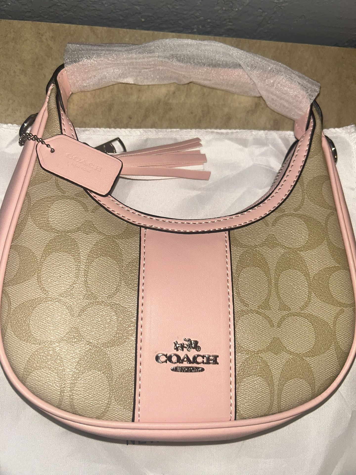 pink and tan coach shoulder purse