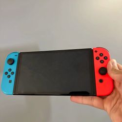  Nintendo Switch - OLED Model w/Neon Red & Neon Blue Joy-Con