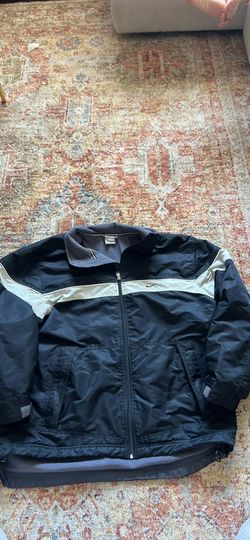 vintage early-2000s Nike fleece-lined nylon windbreaker jacket.