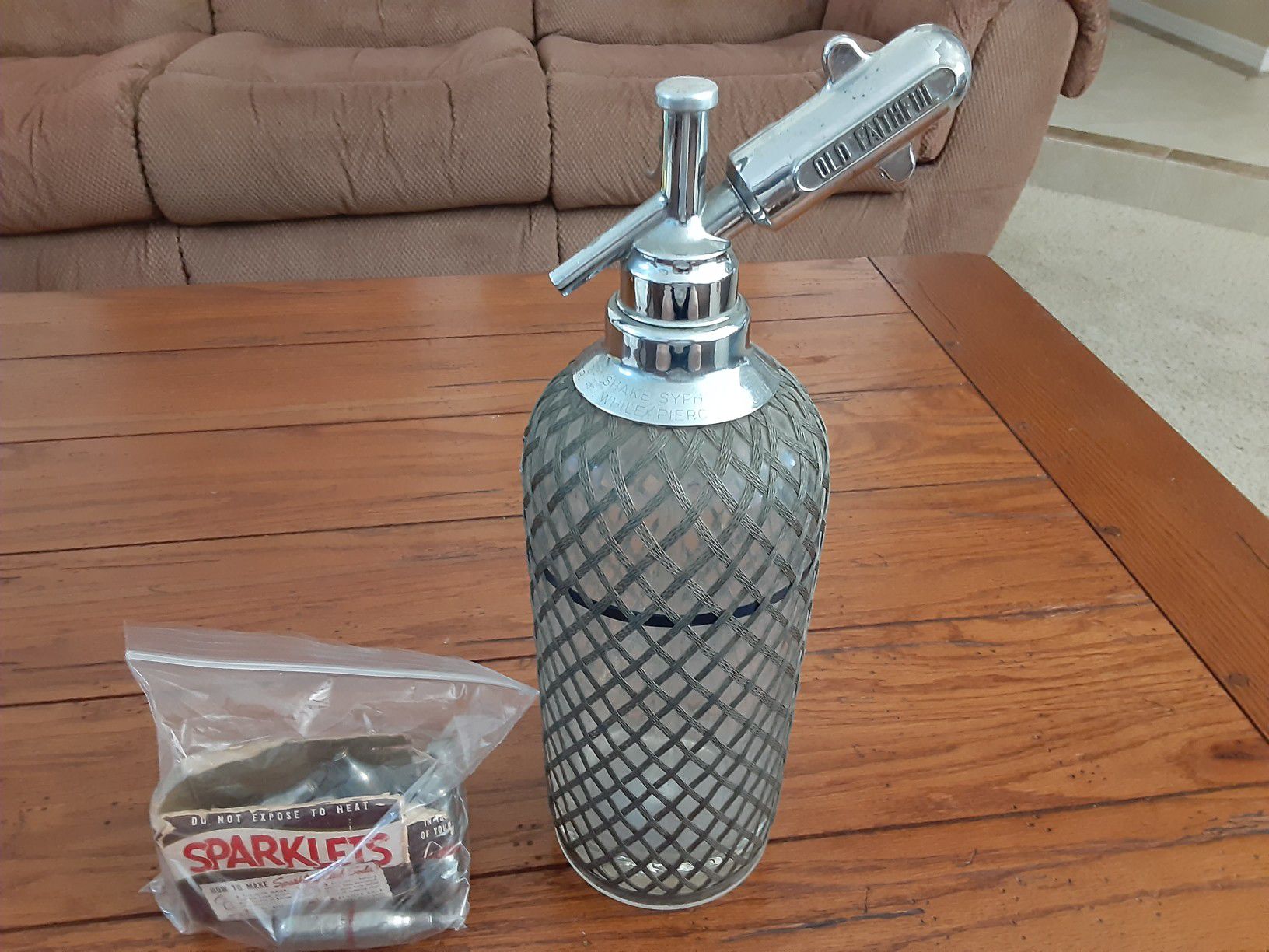 Beautiful Antique Seltzer Bottle with beautiful mesh wrapping with box of 10 Chargers.