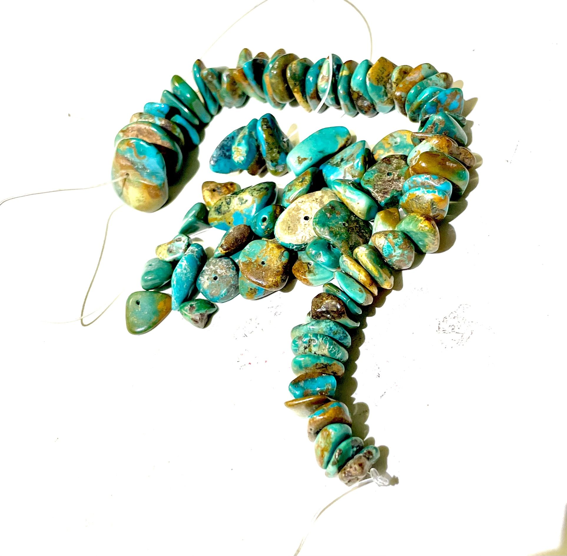 Various Sizes Of Turquoise Beads