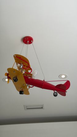Airplane hanging light with restoration hardware bed