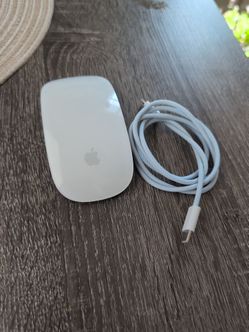 Apple Magic Mouse 2 with its cable
